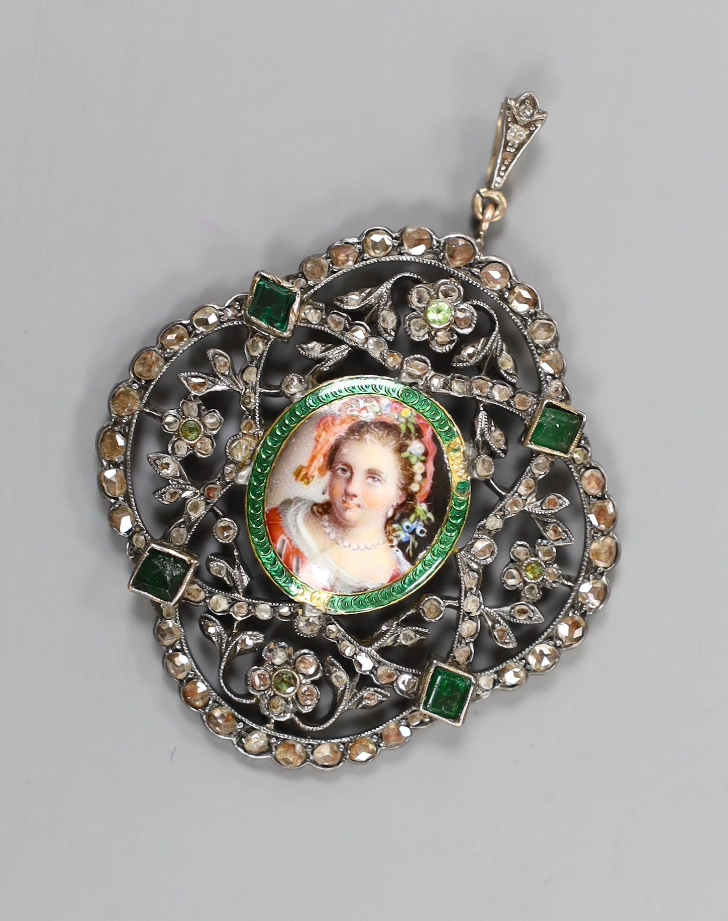 An Indian? white gem enamel and rose cut diamond set portrait pendant, 46mm, gross weight 15.6 grams.